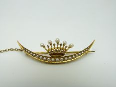 A Victorian 15ct gold brooch set with seed pearls and diamonds in the form of a coronet and