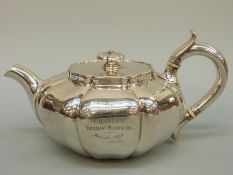 A Victorian hallmarked silver teapot of squat lobed form, London 1844 maker Walter Morisse,