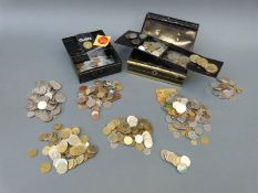 Overseas currency and two tins of miscellaneous coinage,