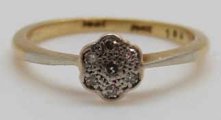 An 18ct gold ring set with diamonds in a platinum setting, 2.