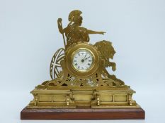 A c1900 brass mantel clock with Roman dial and blued spade hands,
