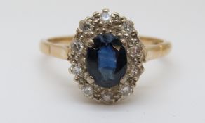 An 18ct gold ring set with an oval sapphire,