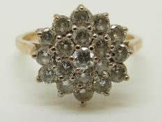 A 9ct gold ring set with cubic zirconia in a large cluster, 2.