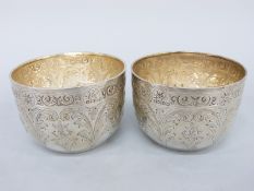 A pair of Victorian hallmarked silver bowls or wine cups with acanthus leaf decoration,