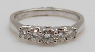 An 18ct white gold ring set with five diamonds totalling approximately 0.5ct,3.