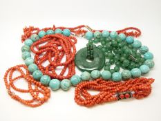 A turquoise necklace, three coral necklaces,