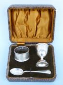 A cased hallmarked silver three piece cruet set