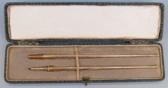 A cased yellow metal dip pen and pencil set, each marked 9ct, weight of both 8.