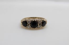A 9ct gold ring set with sapphires (size M)