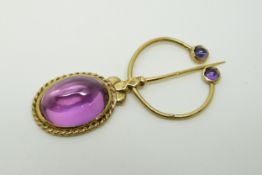 A gold scarf pin set with amethyst cabochons, marks indistinct, 5.8 x 2.