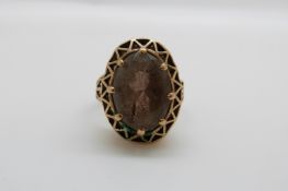 A 9ct gold ring set with a large smoky quartz (size N)