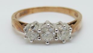 A 9ct gold ring set with three diamonds, total 0.