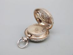 An Edward VII hallmarked silver sovereign holder with sprung interior and suspension loop,