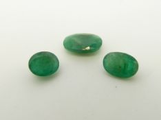 Three oval cut emeralds the largest approximately 1.