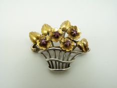 A 9ct bi-coloured gold brooch set with rubies in the form of a basket of flowers, 3.