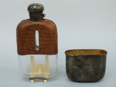 A Victorian hallmarked silver hip flask, part crocodile skin covered,