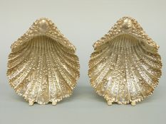 A pair of Victorian hallmarked silver shell shaped three footed bonbon dishes,