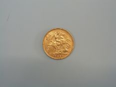 A 1909 gold half sovereign.