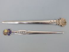 An Irish hallmarked silver letter opener with shell finial bearing import marks and Royal Irish
