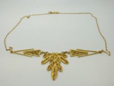 A yellow metal filigree necklace, 12.