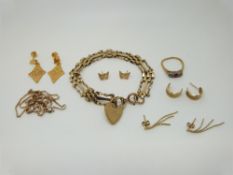 A 9ct gold gate bracelet with heart clasp, a quantity of 9ct and yellow metal earrings (14.