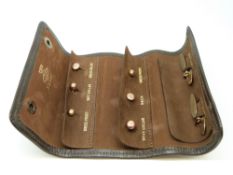 A set of 9ct gold studs and cufflinks in fold-up leather wallet (10.