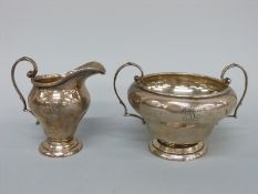 A hallmarked silver cream jug and sucrier, Birmingham 1919 maker G. M. Co.