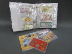 A collection of overseas banknotes and coins in a folder,