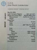 A platinum ring set with a modern round brilliant cut diamond measuring 0.