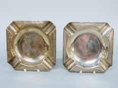 A pair of hallmarked silver ashtrays with engine turned borders, Birmingham 1911 maker H F Withers,