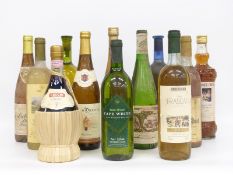 Twelve bottles of white wine and other alcohol to include 1975 Lutomer Laski Riesling, 1992 Soave,