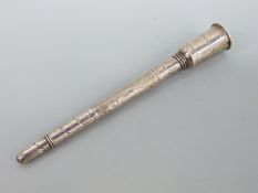 An 18thC silver travelling combined dip pen or penner with a slide out reversible nib and a screw