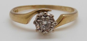 An 18ct gold ring set with a diamond, 3.