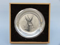 A white metal shallow plate decorated with a gazelle by Bernard Buffet,