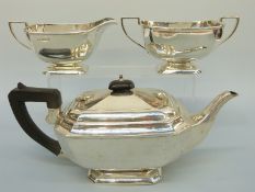 An Art Deco George VI hallmarked silver three piece tea set, London 1938, maker Kemp Brothers,