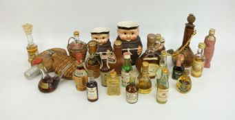 Two novelty long necked bottles of Bessi, the larger 1973 the smaller 1969,