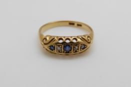 An 18ct gold ring set with sapphires and diamonds (size O)