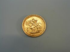 An 1817 George III gold full sovereign with laureate head