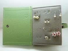 A collection of silver earrings including pearl set, moss agate,