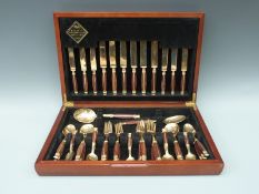 A Regency bronze and rosewood 44-piece canteen of cutlery
