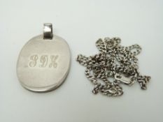 An 18ct white gold chain and a silver pendant, 24.