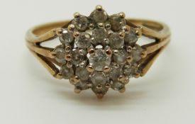A 9ct gold ring set with diamonds in a cluster, 2.