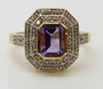 A 9ct gold ring set with an amethyst and diamonds (size M)