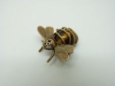 A 9ct gold pendant/ charm in the form of an insect set with tiger's eye, 5.