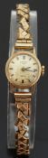 Rotary 9ct gold ladies wristwatch with baton markers and blued hands, on expanding metal bracelet,