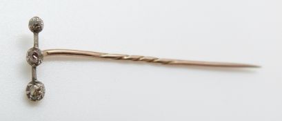 A Victorian stick pin set with old mine cut diamonds, 5.