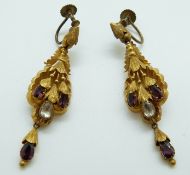 A pair of Victorian pinchbeck repoussé earrings set with foiled garnets and paste