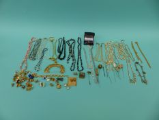 A collection of costume jewellery to include diamante hat pins, glass beads,