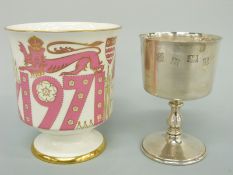 A commemorative feature hallmarked silver goblet and matching china goblet for York centenary,