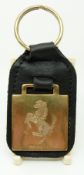A 9ct gold Ferrari key ring with leather fob, B'ham 1998, approximately 12g,